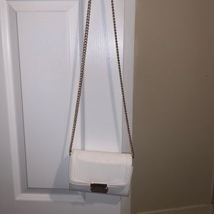 dainty white purse with gold chain strap